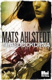 Bild på bokomslag för Trasdockorna