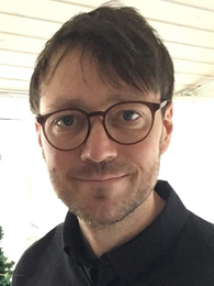 Poträttbild av Mark Wallenius
